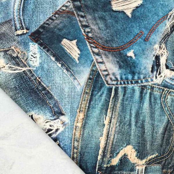 Cotton twill with denim pocket print as fabric on a roll