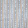 White broderie anglaise with flowers and bows, cutwork pattern and texture
