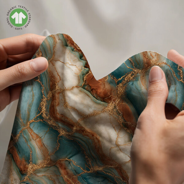 Detail of marble look on cotton jersey fabric in petrol and cream