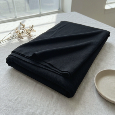 Värinäyte: musta merinovilla-silkki rib-jersey
