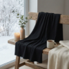Tekstuurikuva Black rib-neulotusta merinovilla-silkki jerseystä