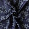Chambray metrikangas 150 cm leveä -- tummansininen farkku kukilla