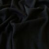 Lähikuva rib-rakenteesta Black merinovilla-silkki jerseystä