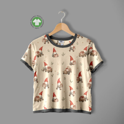 Repeat view of gnomes and gift cart print on taupe jersey fabric