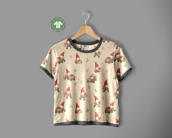 Repeat view of gnomes and gift cart print on taupe jersey fabric