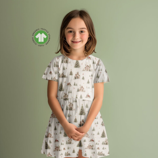 Repeat view of snow-covered village print with hearts on jersey fabric