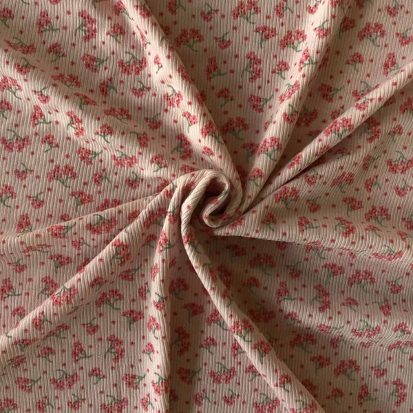 Detalje af blomsterprint på merinould/silke ribstrik 200 g/m²