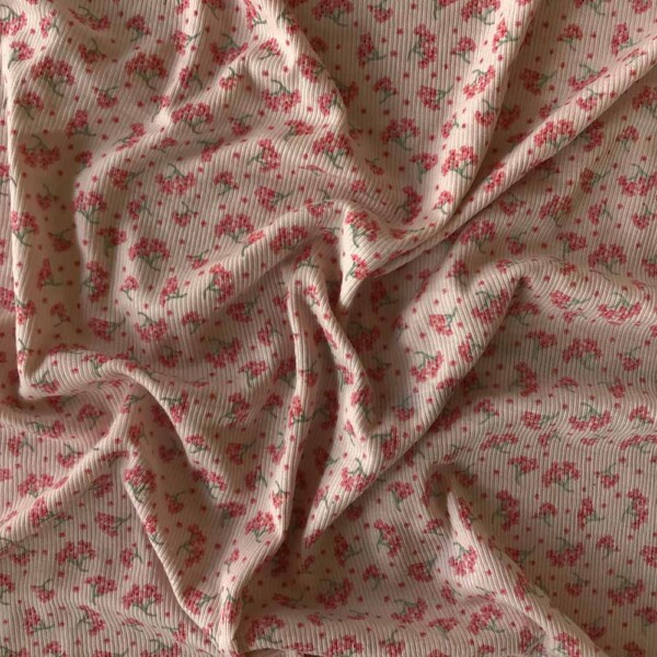 Struktur i 2/1 ribstrik på merinould silke jersey med print