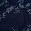 Jacquard-kudottu denim-kangas navy-sävyssä kukkiva oksa -kuviolla
