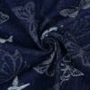 Jacquardkudottu navy-denim perhoskuviolla