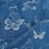 Yksityiskohta: denim-jacquard-rakenne perhoskuosilla