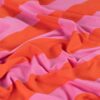 Loop back interior of french terry fabric with orange and light pink stripes