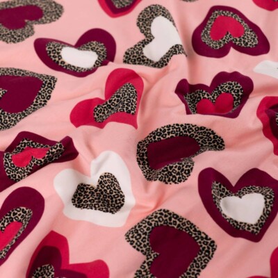 French terry brushed reverse with loops, leopard hearts on light pink