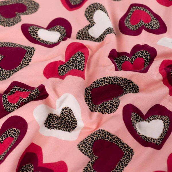 French terry brushed reverse with loops, leopard hearts on light pink