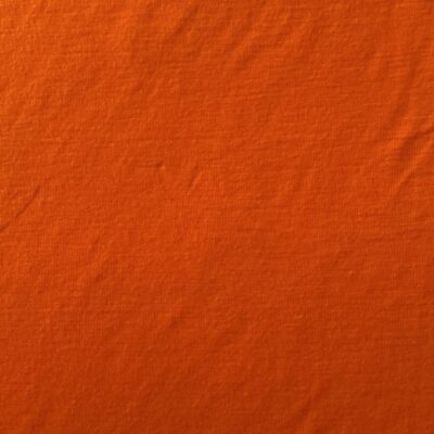 Brændt Orange merinould jersey, fladt udlagt, så ribstrikken ses