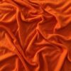 Brændt Orange merinould jersey, lagt i bløde folder