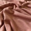 Terracotta merinould jersey, tæt på ribstrikkens struktur