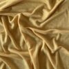 Curry Yellow merino wool jersey, arranged in soft folds