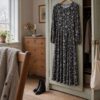 Dress in black viscose jersey with white flowers