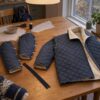 Child's jacket in dark denim quilt with teddy back, being sewn