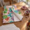 Reversible child's vest in quilted muslin with colourful flowers