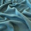 Aqua merino wool jersey fabric, close-up of the rib knit texture