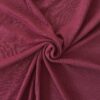 Cranberry merino wool jersey, twisted into a spiral to show drape