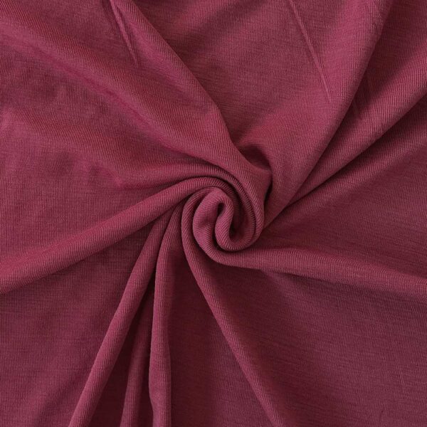 Cranberry merino wool jersey, twisted into a spiral to show drape
