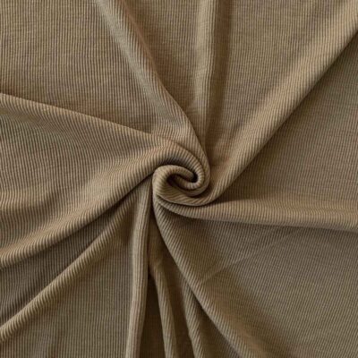 Sand merino wool jersey fabric, twisted into a spiral to show drape