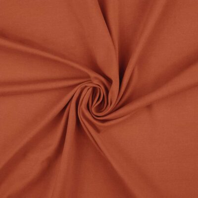Rust red anorak fabric, twill in polyester and cotton