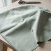 Anorakstof i støvet grøn, twill i polyester og bomuld
