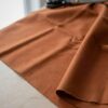 Terrakotanvärinen anorakkikangas, polyesteri–puuvillatwill