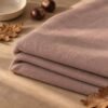 Antique rose merino wool jersey, folded in autumn light