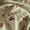 Printed jersey fabric with honey bear and hare in cotton/lycra