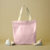 Tote bag in pale pink canvas fabric with light handles (AI-generated illustration)