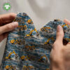 Excavators on petrol, digital print jersey draped to show the fabric drape and softness