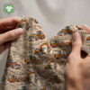 Excavators on sand, digital print jersey draped to show the fabric drape and softness