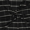 Detail of checked woven wool blend in black and off-white