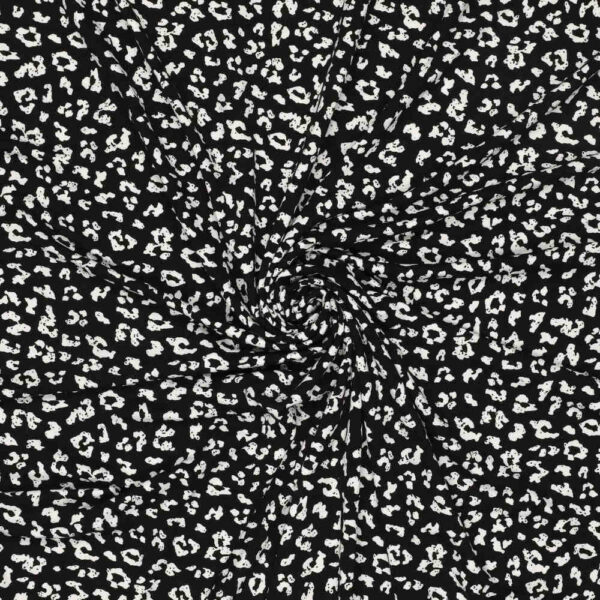 Printed viscose jersey white animal print on black 200 g/m² 150 cm