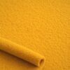 Close-up of the surface of ochre lambskin fleece