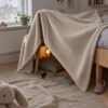 Throw blanket sewn from sand lambskin fleece (AI mockup)