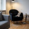 Armchair upholstered in black upholstery velour (AI-generated illustration)