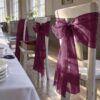 Chair bow made from bordeaux organza for a wedding