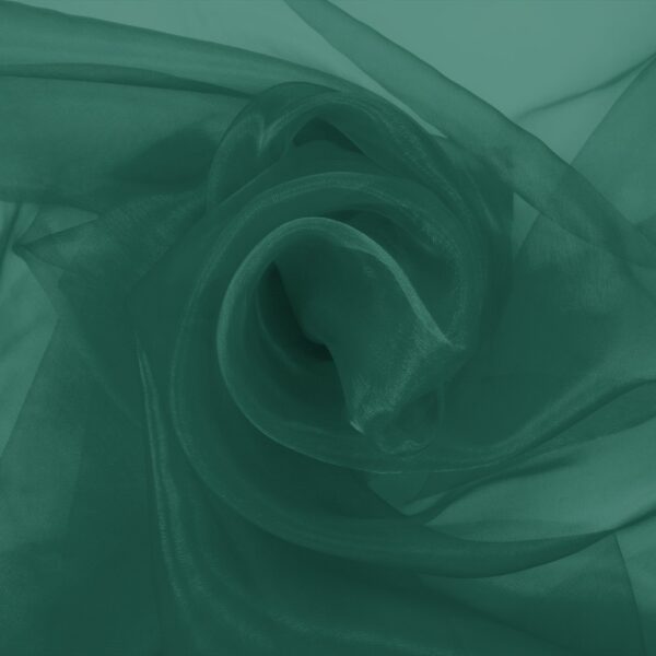 Bottle green organza arranged in soft folds, lightweight transparent fabric