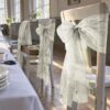 Chair bow made from light greige organza for a wedding