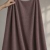 Rose Brown merino wool jersey, held in the hand