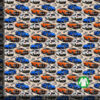Sports cars on a racetrack, digital print jersey on a 36x36 cm measuring ruler, showing the repeat at full scale